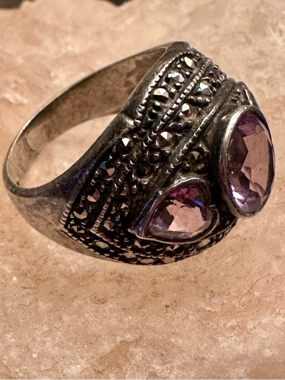 Silver tone ring with purple stones, hearts